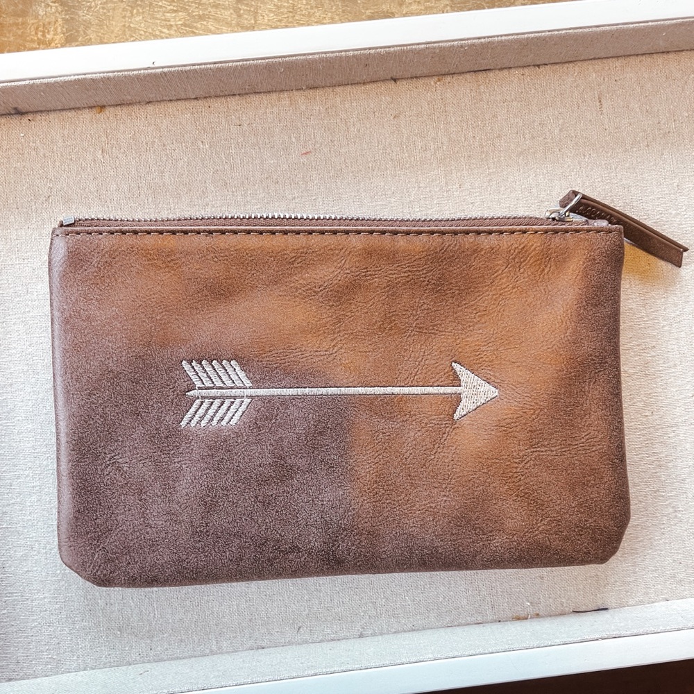 Taupe Stella and Dot arrow wristlet